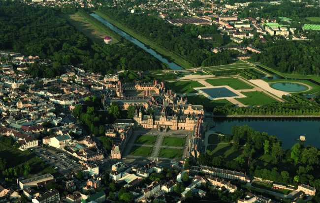 Aerial view of Chateau de Fontainebleau with its gardens, a UNESCO