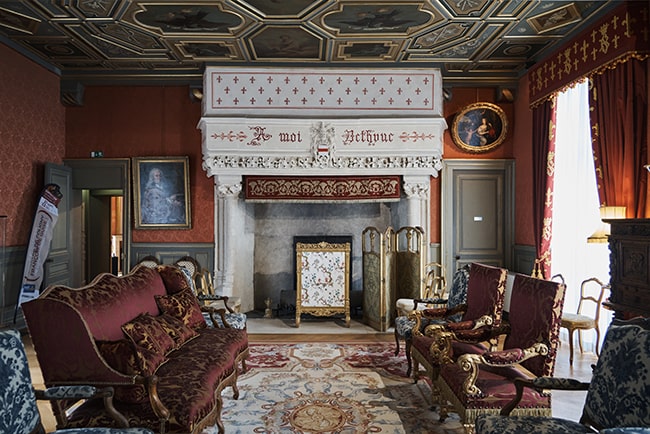 The Great Room with its ornate fireplace and painted ceiling.