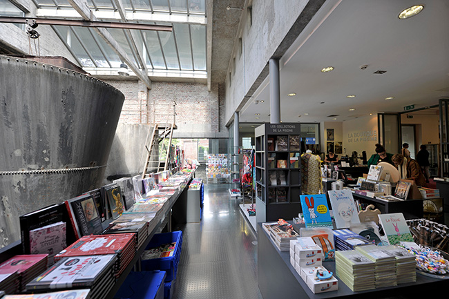 Gift shop in the old filter room, combination of industrial feel and modern books and gifts