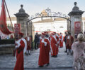 People parade in red robes at the Jurade festival
