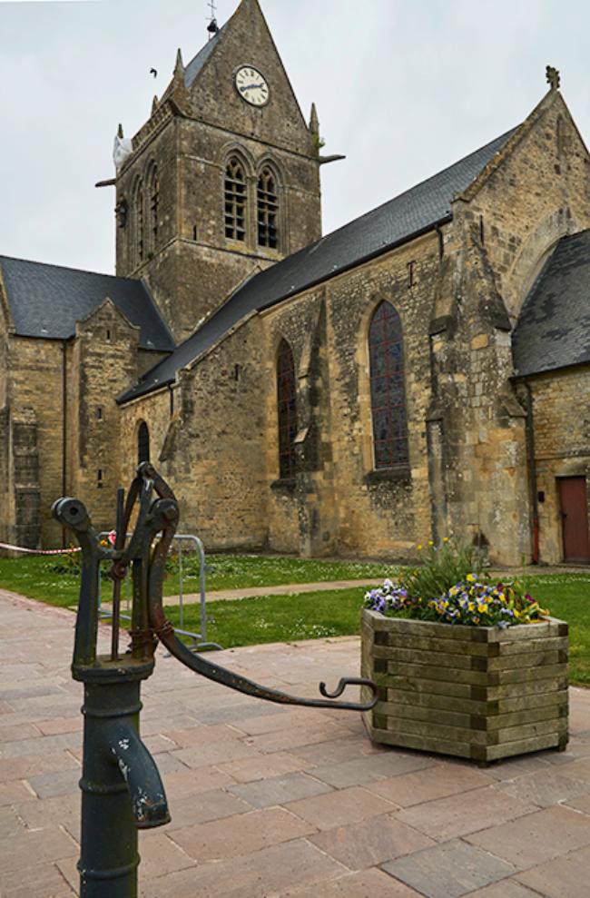 Water pump at church in Sainte-Mere-Eglise